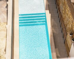 Outdoor pool, open 8:00 AM to 8:00 PM, pool loungers