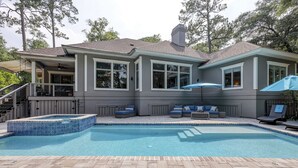 A house with a swimming pool, outdoor seating, and a covered patio area. - Sunset Rentals | Kingston 47 (Hilton Head Island)