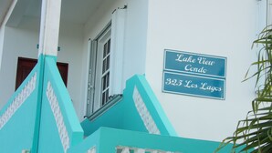 A building with a sign reading "Lake View Condo 325 Los Lagos."