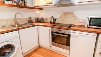 Fridge, electric kettle, toaster, cookware/dishes/utensils