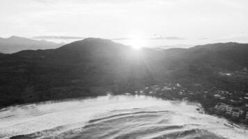 On the beach, white sand, beach towels, beach bar