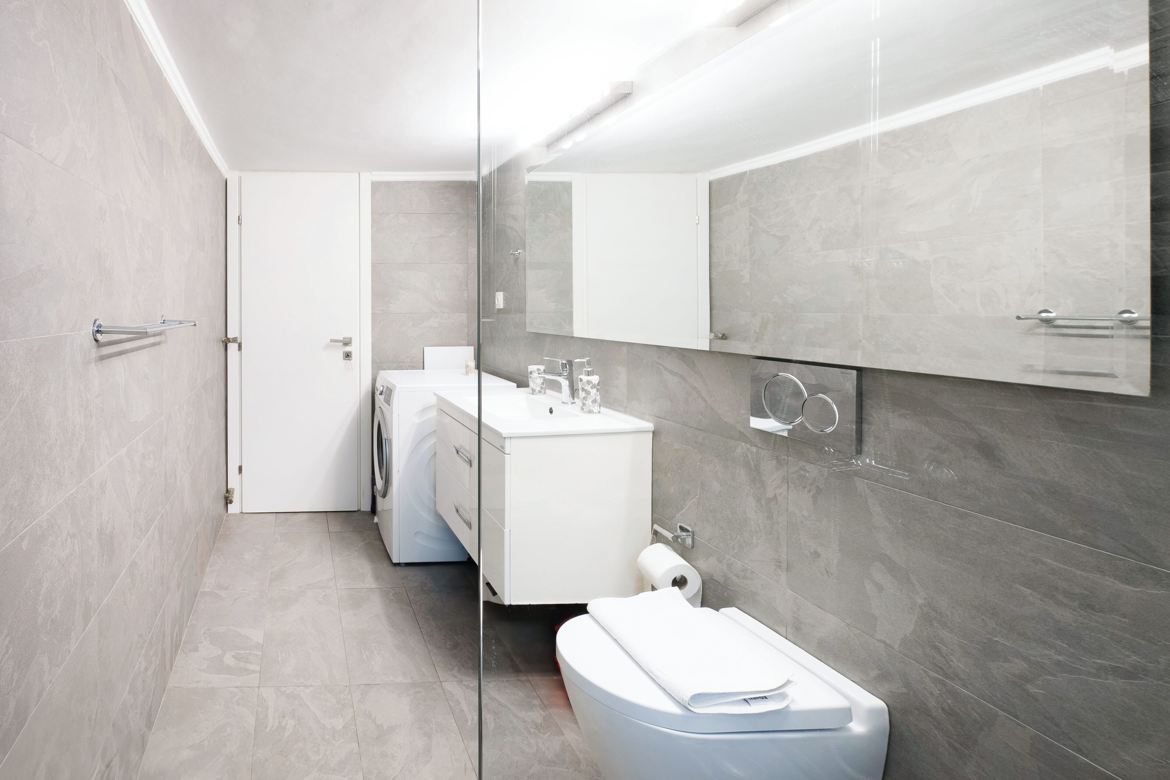 Shower, hair dryer, slippers, towels