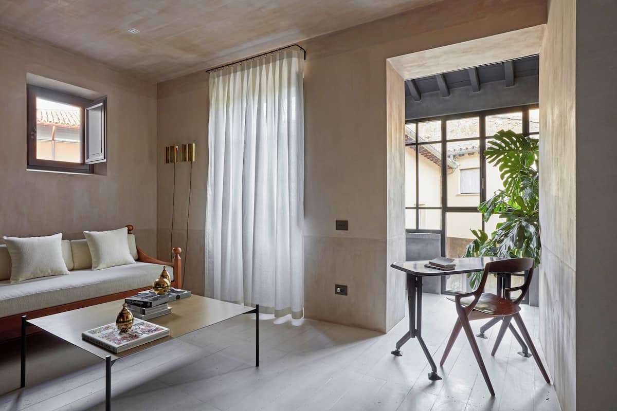 Suite, 1 King Bed | Living area | 50-inch LED TV with satellite channels, TV, heated floors