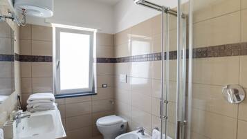 Shower, towels, toilet paper