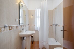 Bathtub, hair dryer, towels