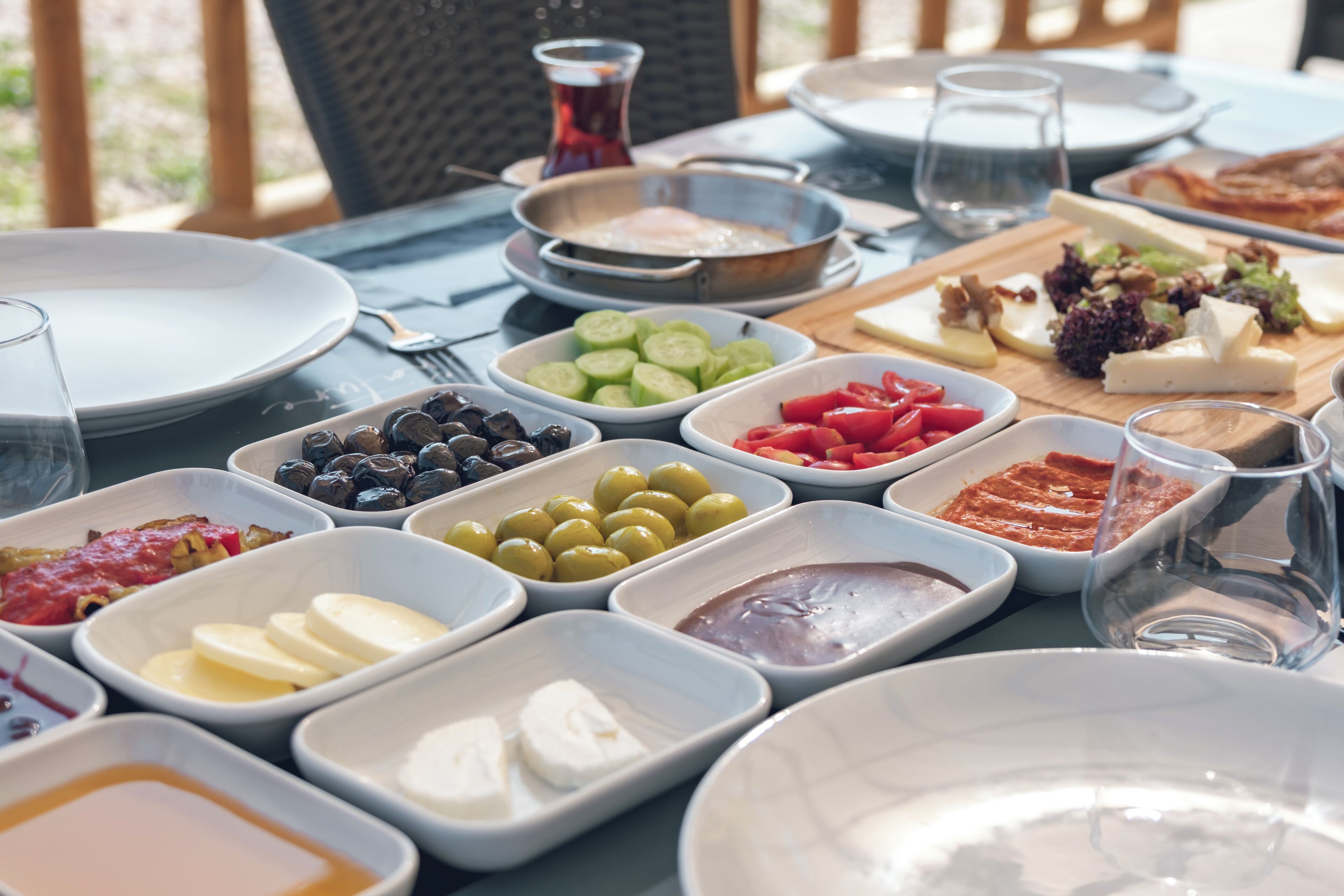 A table set for a meal with various dishes and condiments.
