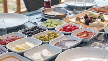 A table set for a meal with various dishes and condiments.