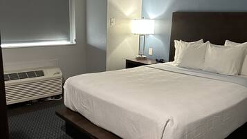 Economy Single Room | Pillowtop beds, desk, blackout drapes, iron/ironing board