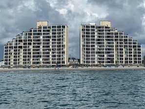 A beachfront hotel with multiple floors, balconies, and a beach view. - BEACHFRONT 3 BR, 3 BATH CONDO
NEWLY RENOVATED-GORGEOUS (Murrells Inlet)