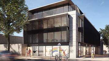 A modern building with a fashion shop on the ground floor.