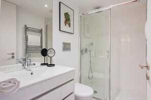 Shower, hair dryer, towels, soap