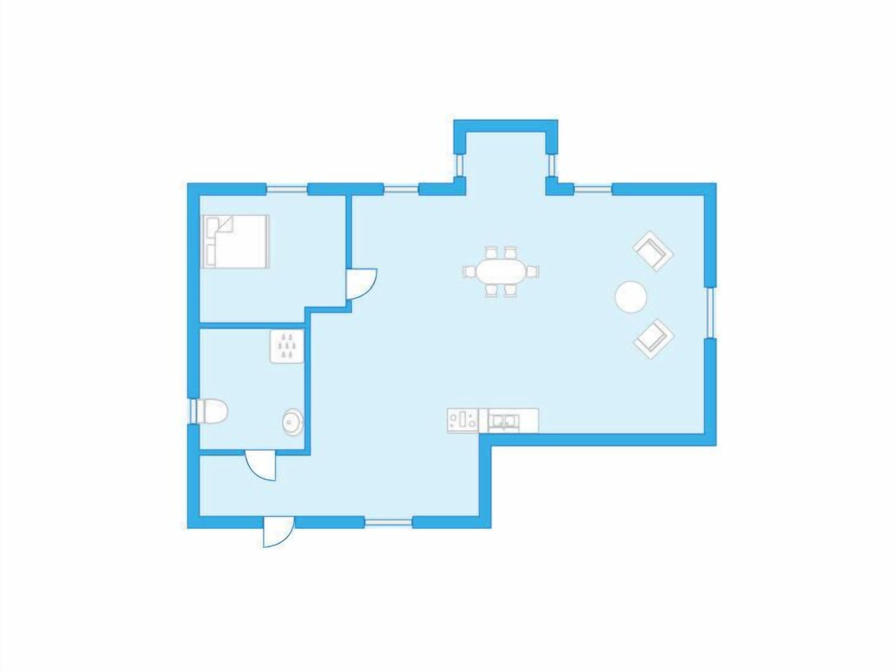A floor plan with a living area, dining space, kitchen, and bathroom.