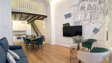 Family Apartment | Living area | 55-inch flat-screen TV with cable channels, TV