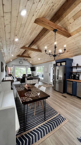 SHORT WALK TO WATER & NESTLED IN THE TREES THIS BEAUTIFUL CABIN HAS LAKE VIEWS