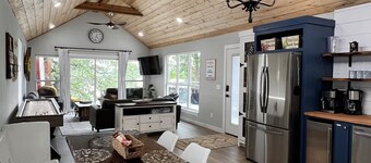 SHORT WALK TO WATER & NESTLED IN THE TREES THIS BEAUTIFUL CABIN HAS LAKE VIEWS