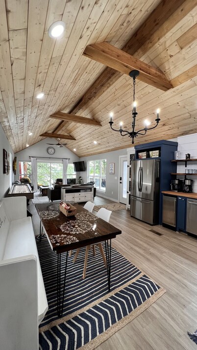 SHORT WALK TO WATER & NESTLED IN THE TREES THIS BEAUTIFUL CABIN HAS LAKE VIEWS