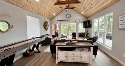 SHORT WALK TO WATER & NESTLED IN THE TREES THIS BEAUTIFUL CABIN HAS LAKE VIEWS