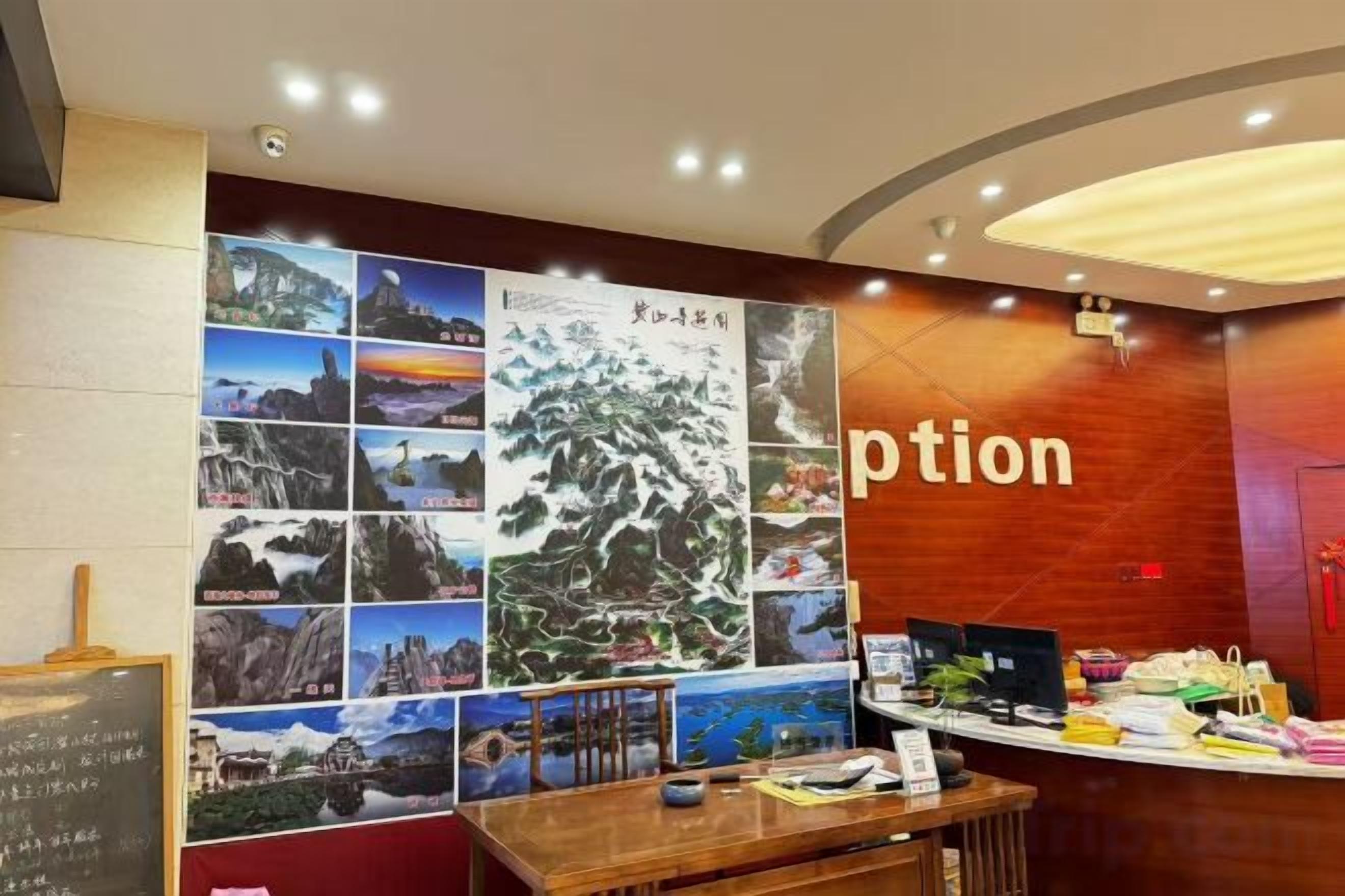 A reception area with a wooden desk, a bulletin board with photos, and a wall with the word 'ption' partially visible.