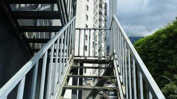 A metal staircase leading to a building's entrance.