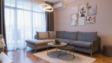 Deluxe Apartment | Living area | 32-inch Smart TV with cable channels, TV