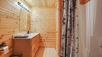 Bathtub, hair dryer, towels, soap