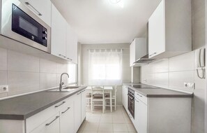 Fridge, microwave, stovetop, cookware/dishes/utensils