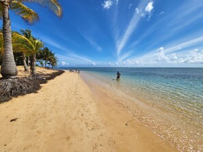 On the beach, sun-loungers, beach towels