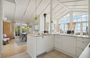 Fridge, stovetop, dishwasher, coffee/tea maker