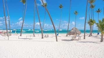 On the beach, sun-loungers, beach towels