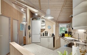 Fridge, stovetop, dishwasher, coffee/tea maker