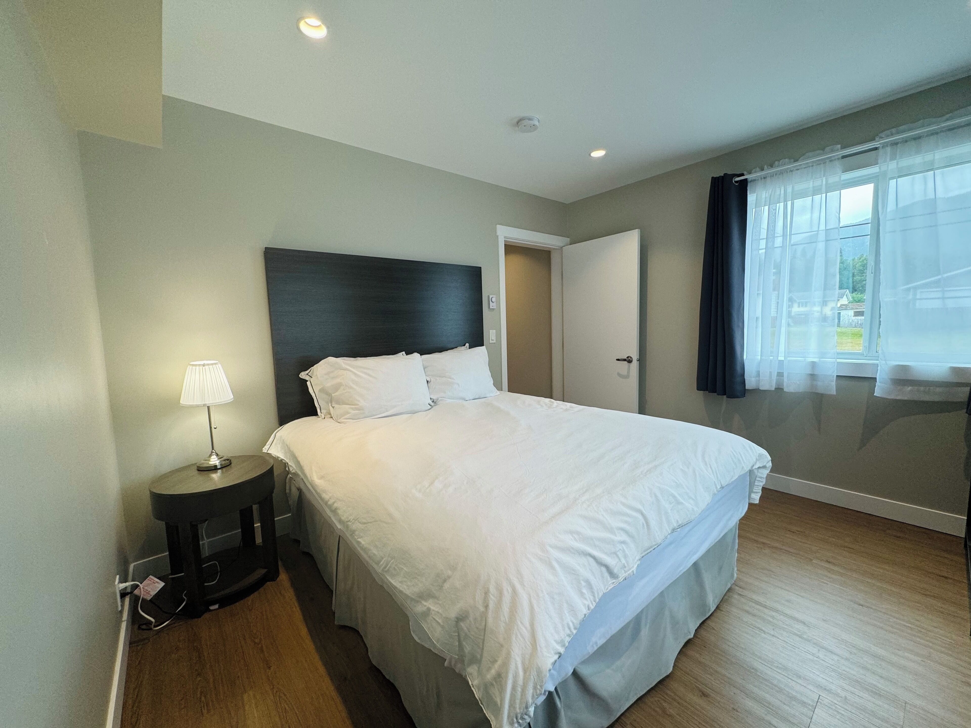 Elite Suite | Premium bedding, desk, laptop workspace, blackout curtains