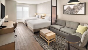 A modern hotel room with two beds, a sofa, a desk, and a TV. - Hyatt Place Munster (Munster)