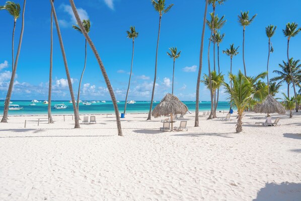 On the beach, sun loungers, beach towels