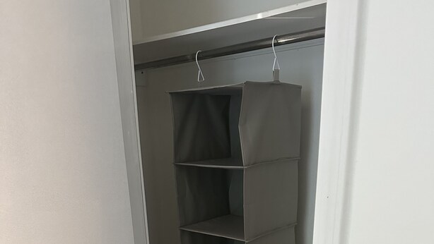 A closet with a grey hanging organizer. - The Cove at Lake Houser-lakefront home, large deck, fishing/kayak/paddle board (Mooresboro)