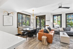 TV, fireplace, books - Experience mountain views at Blackstone Escape, a spacious 3BR townhouse in Park City. (Park City)