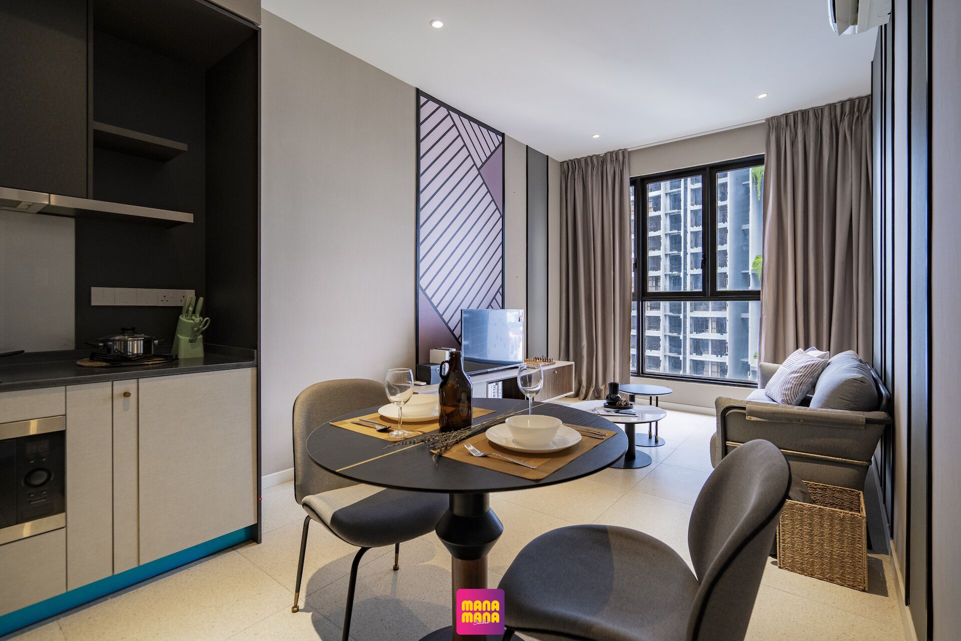 A modern living room with a sofa, a dining table with chairs, a TV, and a kitchen area with a stove and utensils.
