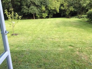 A grassy outdoor area with trees in the background. - Relaxing holiday in quiet surroundings (Frederikshavn)