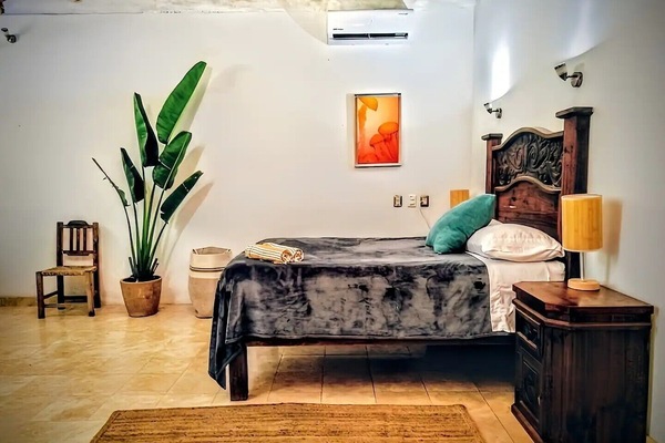 gorgeous bedroom with palapa roof