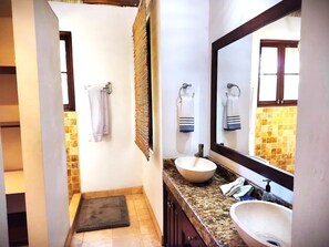 Shower, hair dryer, towels, toilet paper