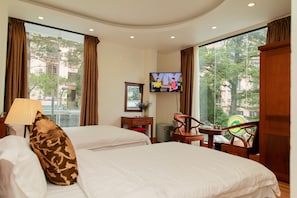 Habitación triple Deluxe | Sábanas de algodón egipcio y ropa de cama de alta calidad