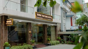 The Eden Tam Dao Hotel with a modern facade, large glass windows, and a signboard. - Eden Tam Dao Hotel (Tam Dao)