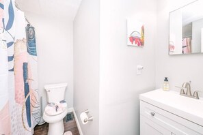 Bathtub, hair dryer, towels