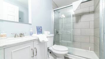 Shower, hair dryer, towels, shampoo
