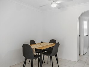 Enjoy meals in this dining area with a rectangular table and four chairs.