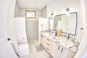 Shower, hair dryer, towels, shampoo