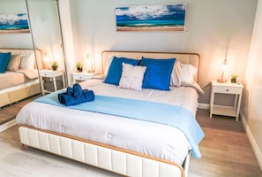 1 bedroom, desk, iron/ironing board, travel crib