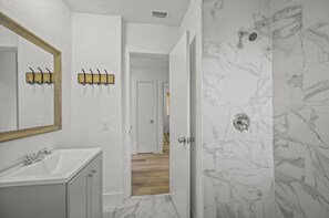 Shower, hair dryer, towels, soap