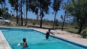 A rectangular swimming pool with clear blue water, surrounded by a concrete deck. - Moholoholo lodge  (Bushbuckridge)