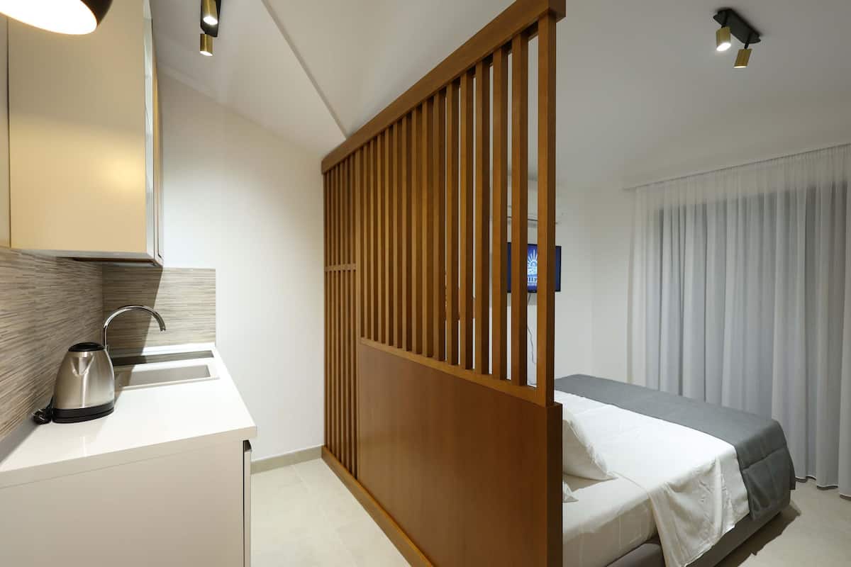 Standard Studio with French Balcony and Sea View (2 Adults) | Living area | 55-cm LCD TV with cable channels, TV