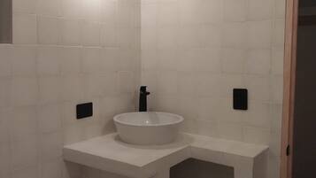 Shower, towels, soap, toilet paper